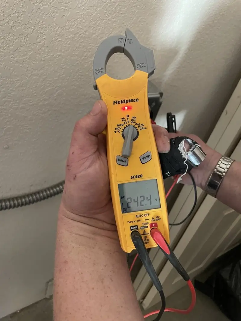 Voltage testing with clamp meter during Aluminum Wiring Replacement in North Braddock